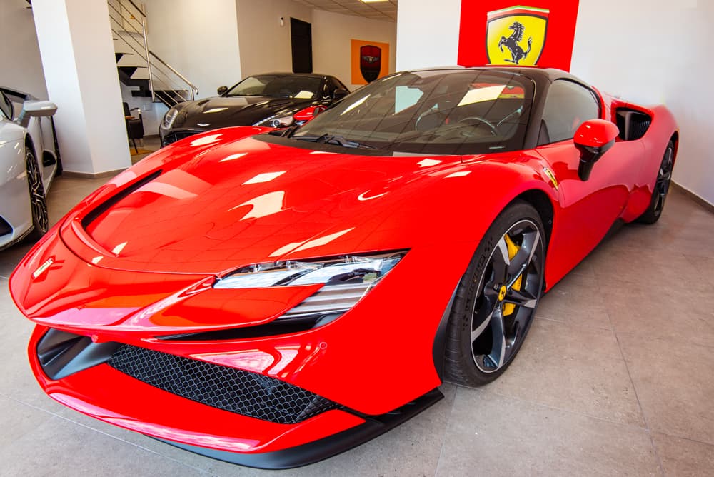 A red Ferrari SF90 Stradale in our showroom.